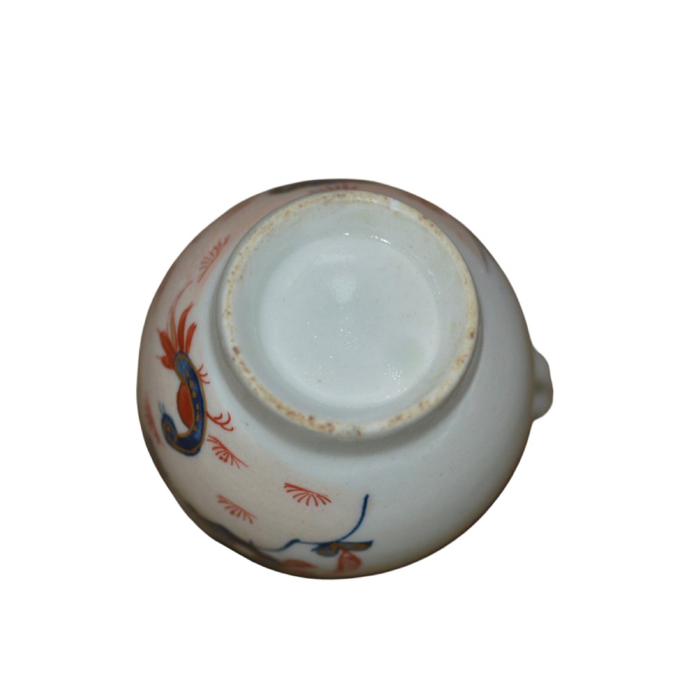 An 18th-century Lowestoft soft-paste porcelain sparrow-beak jug featuring hand-painted red and blue foliage and bird motifs. View VIII
