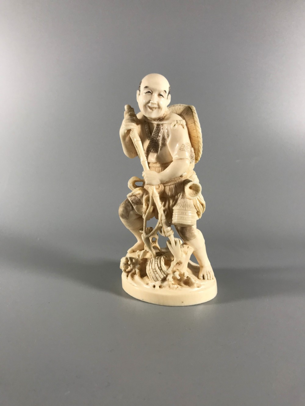 JAPANESE IVORY OKIMONO of a FISHERMAN View II