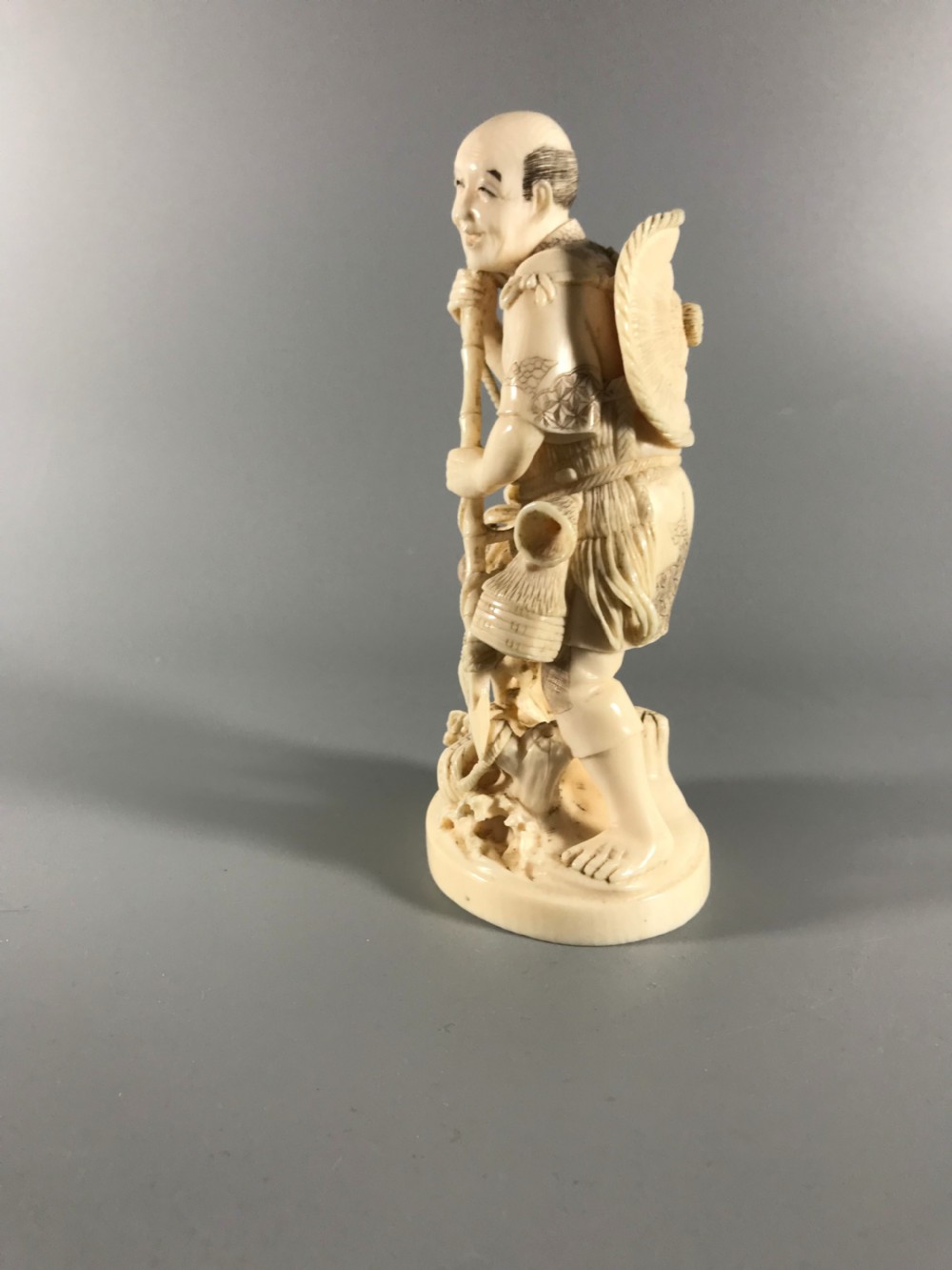 JAPANESE IVORY OKIMONO of a FISHERMAN View III