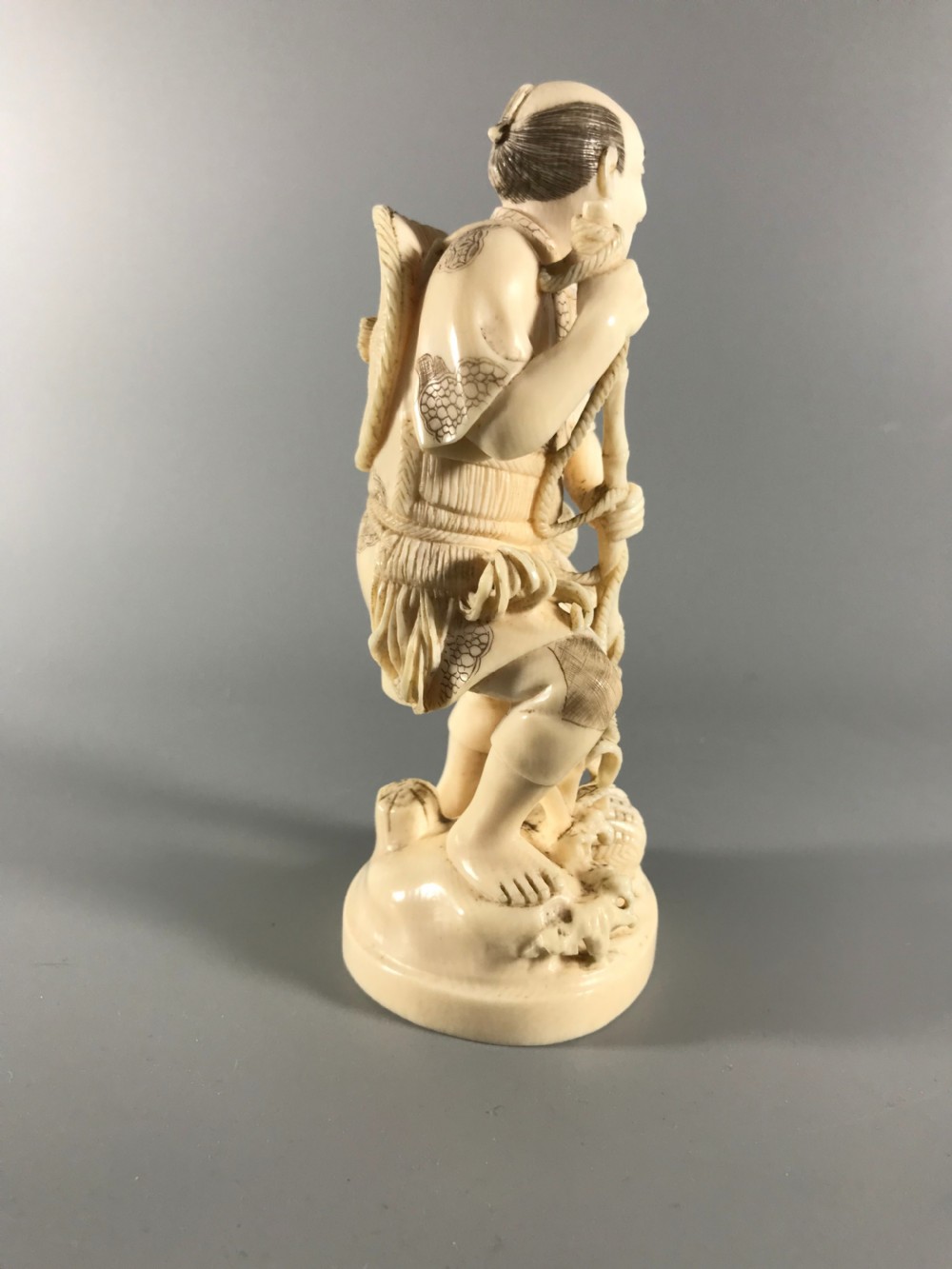 JAPANESE IVORY OKIMONO of a FISHERMAN View V