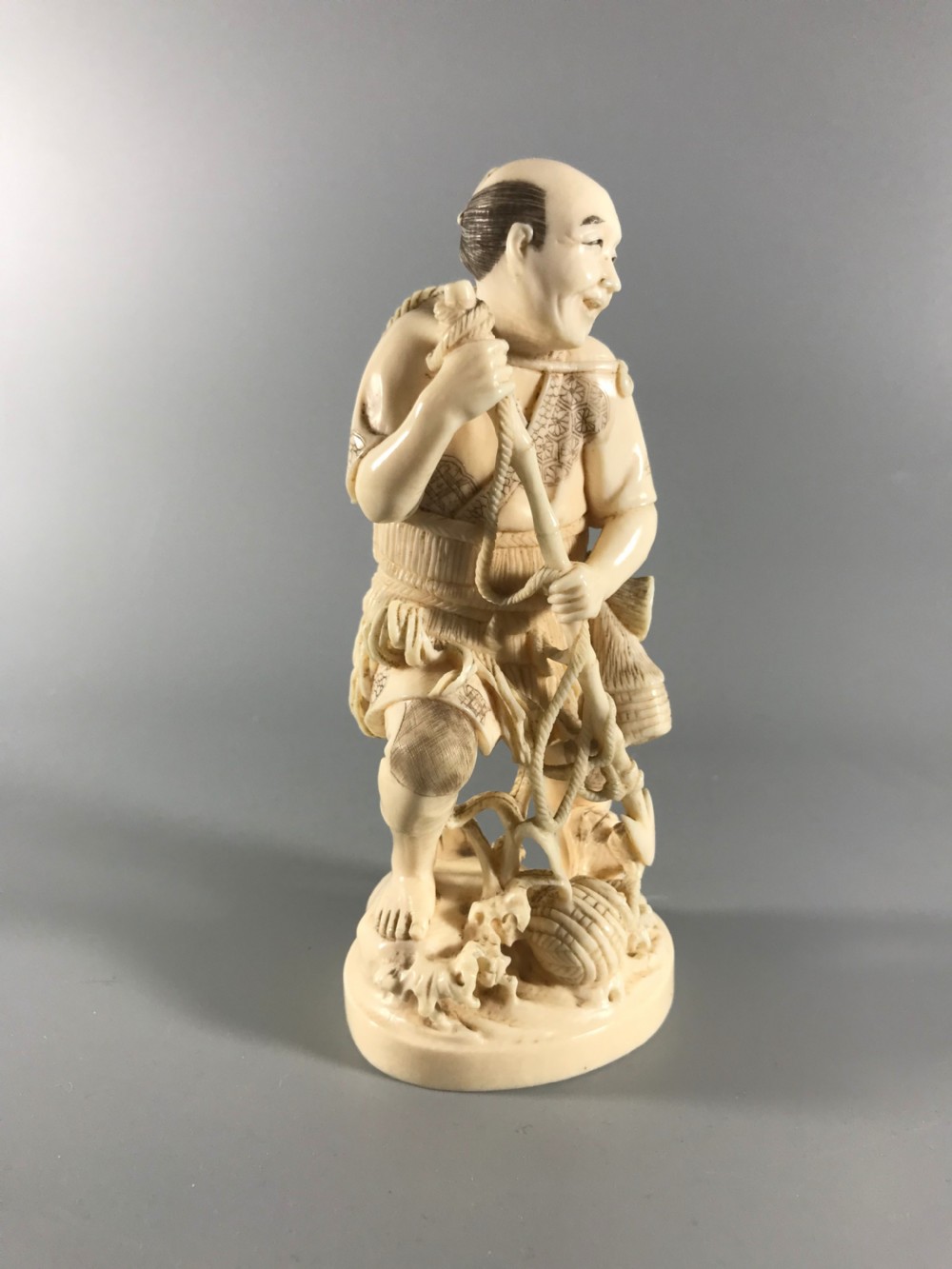JAPANESE IVORY OKIMONO of a FISHERMAN View VI