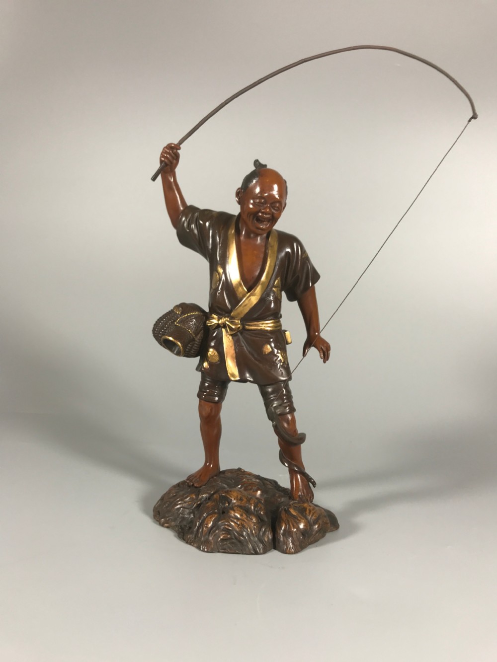 Japanese bronze okimono of a fisherman