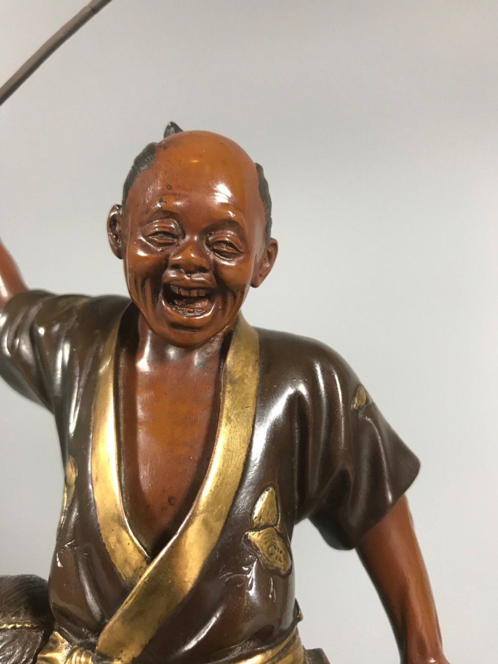 Japanese bronze okimono of a fisherman View II