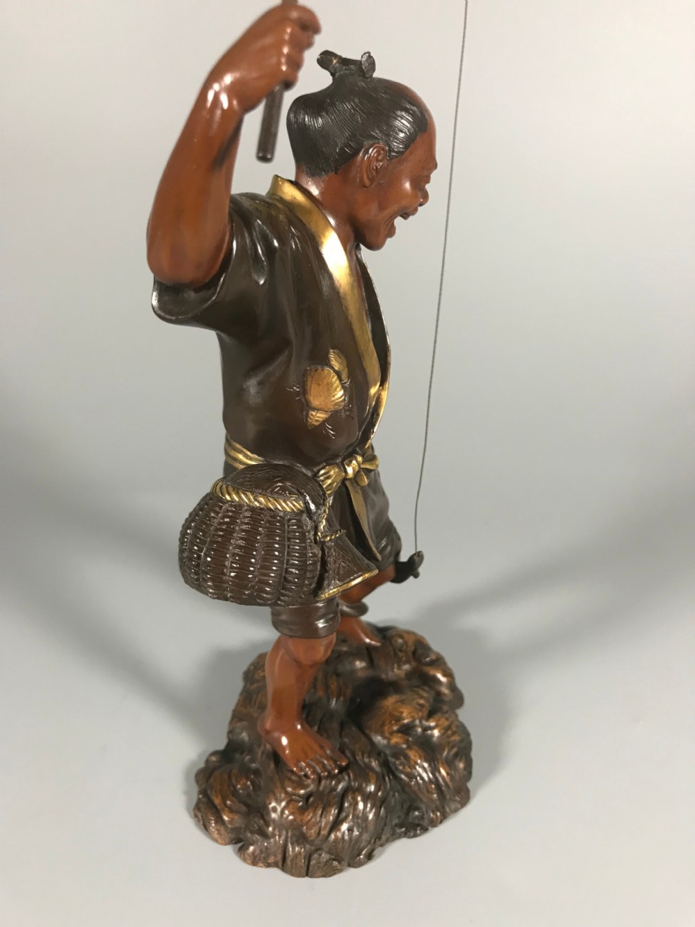 Japanese bronze okimono of a fisherman View IV