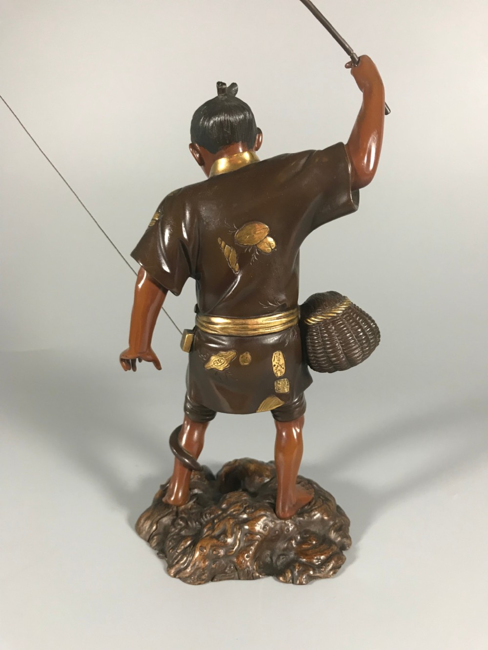 Japanese bronze okimono of a fisherman View V