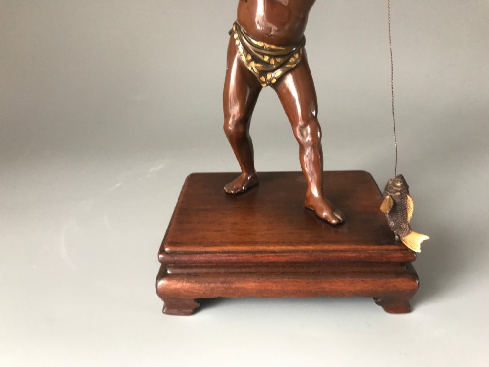 JAPANESE INLAID BRONZE OF A FISHERMAN . View II