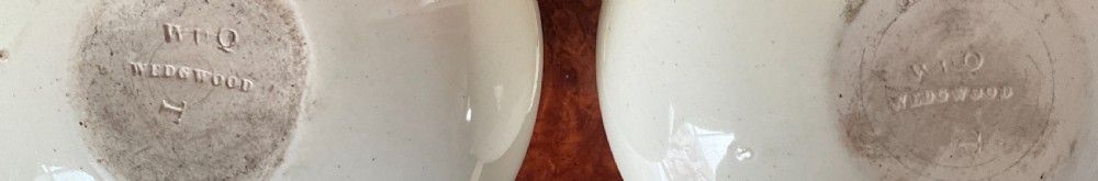 A pair of bulbous cream earthenware vases with orange-trimmed tops, decorated with painted oval cartouches depicting rural agricultural harvest scenes. View VI