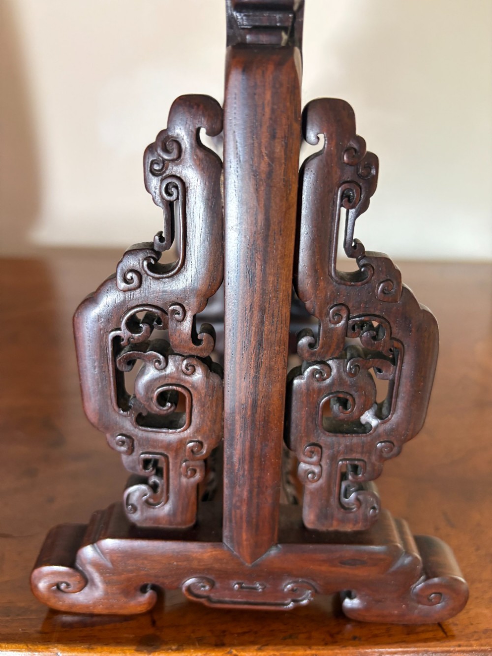 A circular dark wood Japanese table screen featuring raised mother-of-pearl floral and insect inlays, set within a carved hardwood stand. View VI