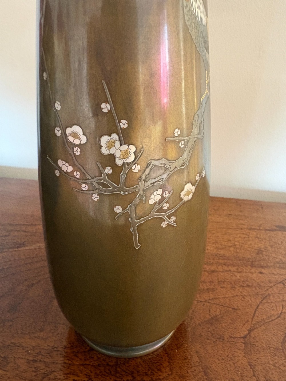 A Japanese Meiji period bronze vase featuring silver and gold inlay depicting a cockerel and hen perched on a flowering branch. View III