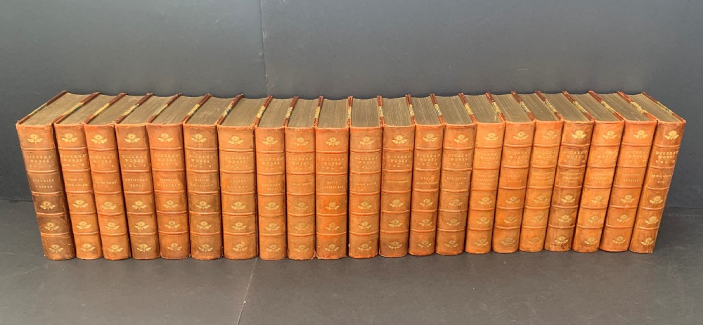 The Authentic Edition of The Works of Charles Dickens complete in 21 uniformly bound books by Riviere & Son dated 1901.
