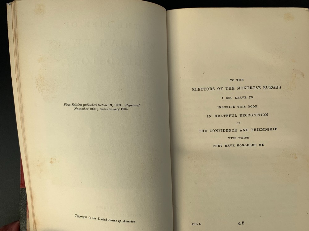 A three-volume set of Edwardian books titled The Life of W E Gladstone, bound in brown half-leather with red cloth sides and gilt spine ornamentation. View XI
