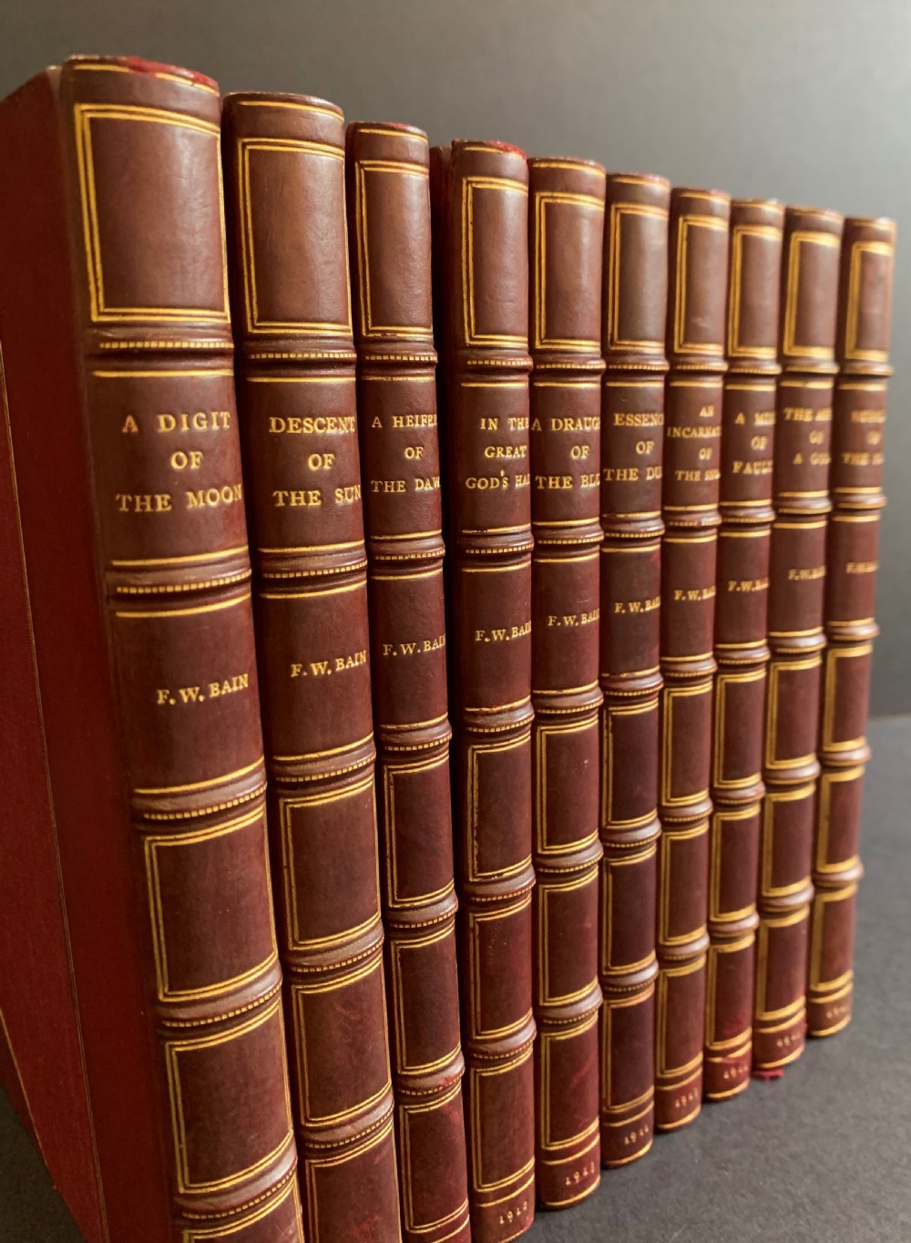 An attractively bound set of books comprising the first 10 Indian Stories of F W Bain dated 1911-1914
