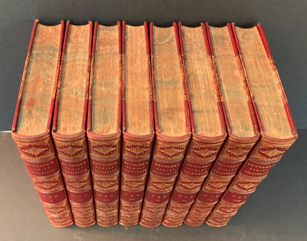 An eight-volume set of 1827 leather-bound books titled Bowdlers Family Shakspeare with red leather spines, raised bands, and gilt decoration. View II