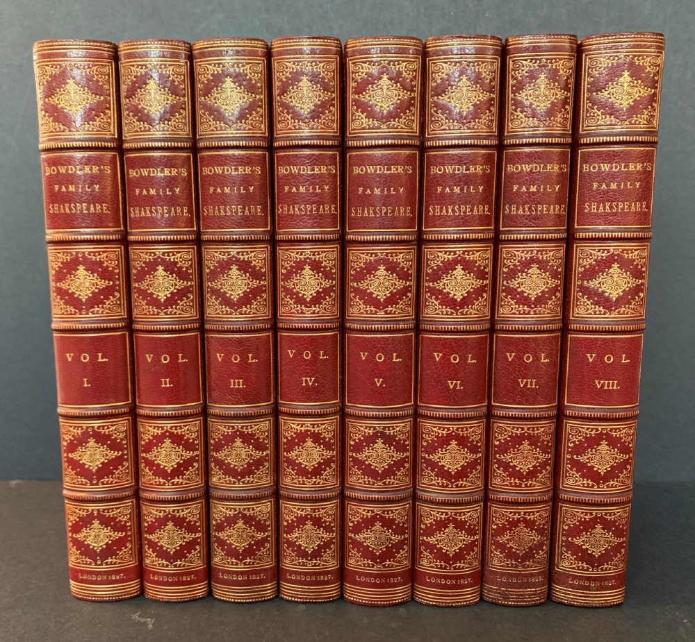 An eight-volume set of 1827 leather-bound books titled Bowdlers Family Shakspeare with red leather spines, raised bands, and gilt decoration. View III
