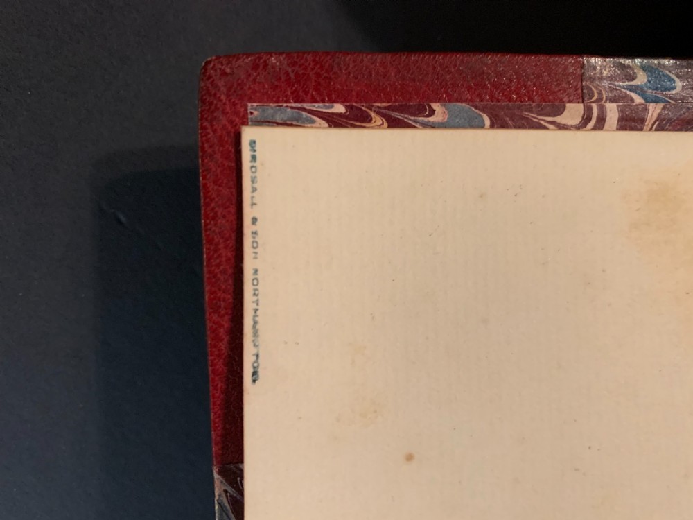 An eight-volume set of 1827 leather-bound books titled Bowdlers Family Shakspeare with red leather spines, raised bands, and gilt decoration. View XXI