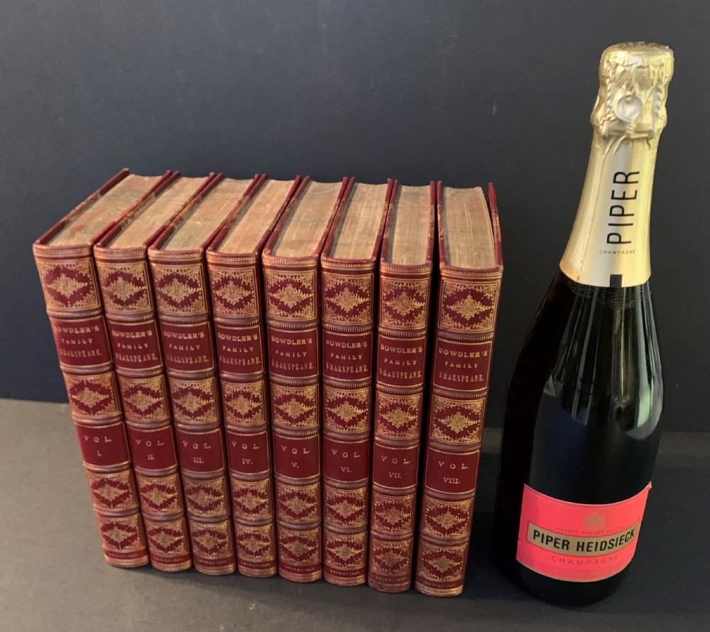 An eight-volume set of 1827 leather-bound books titled Bowdlers Family Shakspeare with red leather spines, raised bands, and gilt decoration. View XXII