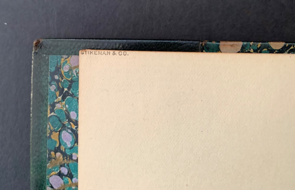 A six-volume set of late Victorian books featuring dark green leather spines with gilt floral tooling and title lettering alongside marbled paper boards. View VI