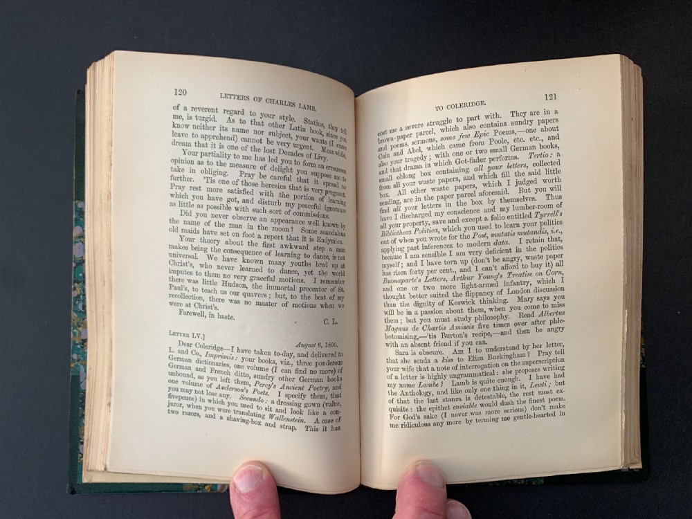 A six-volume set of late Victorian books featuring dark green leather spines with gilt floral tooling and title lettering alongside marbled paper boards. View IX