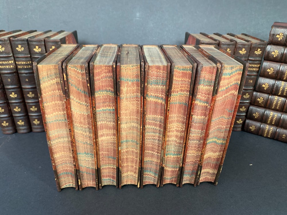 24 uniformly bound books of a 25 volume set of Sir Walter Scott's Waverley Novels dated 1873-1874 View X