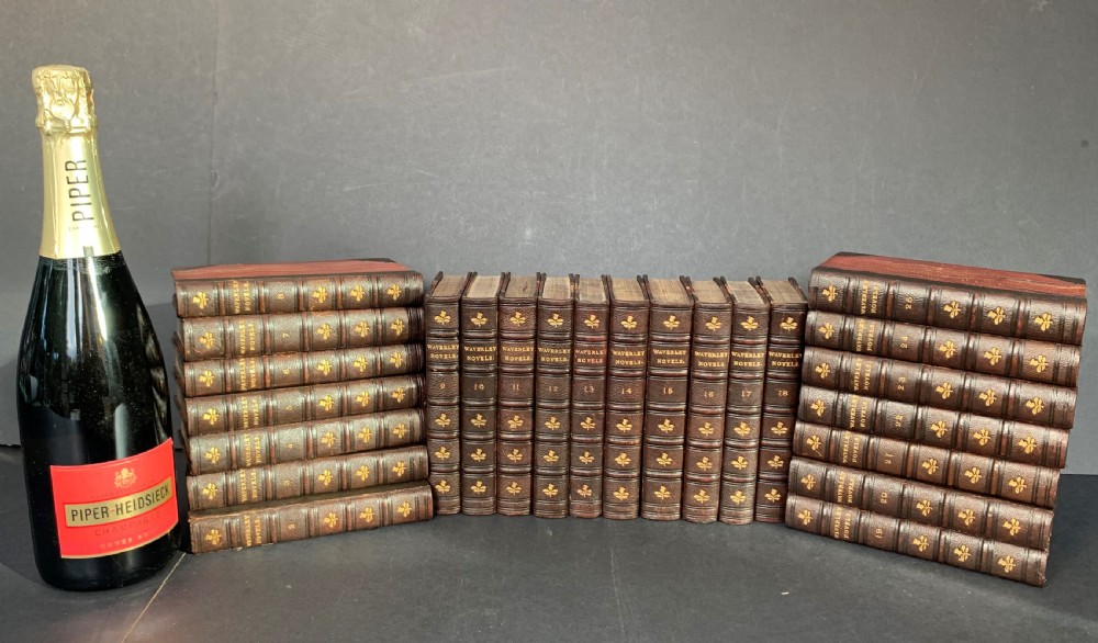 24 uniformly bound books of a 25 volume set of Sir Walter Scott's Waverley Novels dated 1873-1874 View XIII