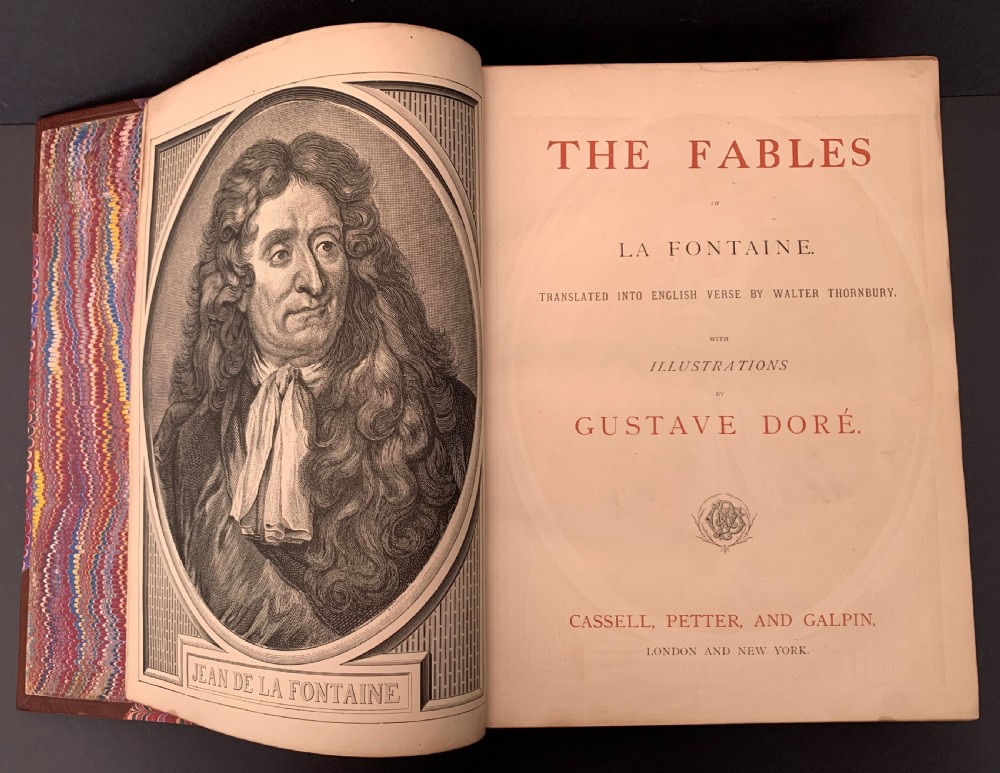 Pair of Victorian half-leather bound books with warm brown spines, gilt lettering on black labels, and red and blue marbled paper boards. View XI