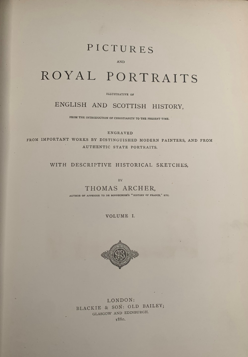 A pair of Victorian leather-bound books featuring gold leaf tooling, crest motifs, and embossed geometric patterns on the brown boards and spines. View IX