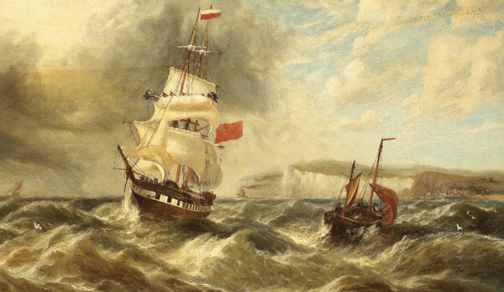 A late nineteenth-century oil painting depicting a British merchant ship in rough seas off a rocky coastline, presented in an ornate gilt frame. View VII