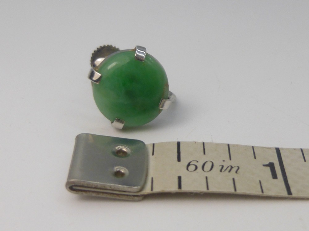 Pair of round green jadeite cabochon earrings set in four-prong white gold mounts with screw-back fittings. View VI
