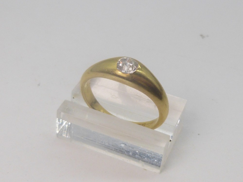 A Victorian 18ct yellow gold gypsy ring featuring a centrally inset round diamond within a smooth tapered band. View III