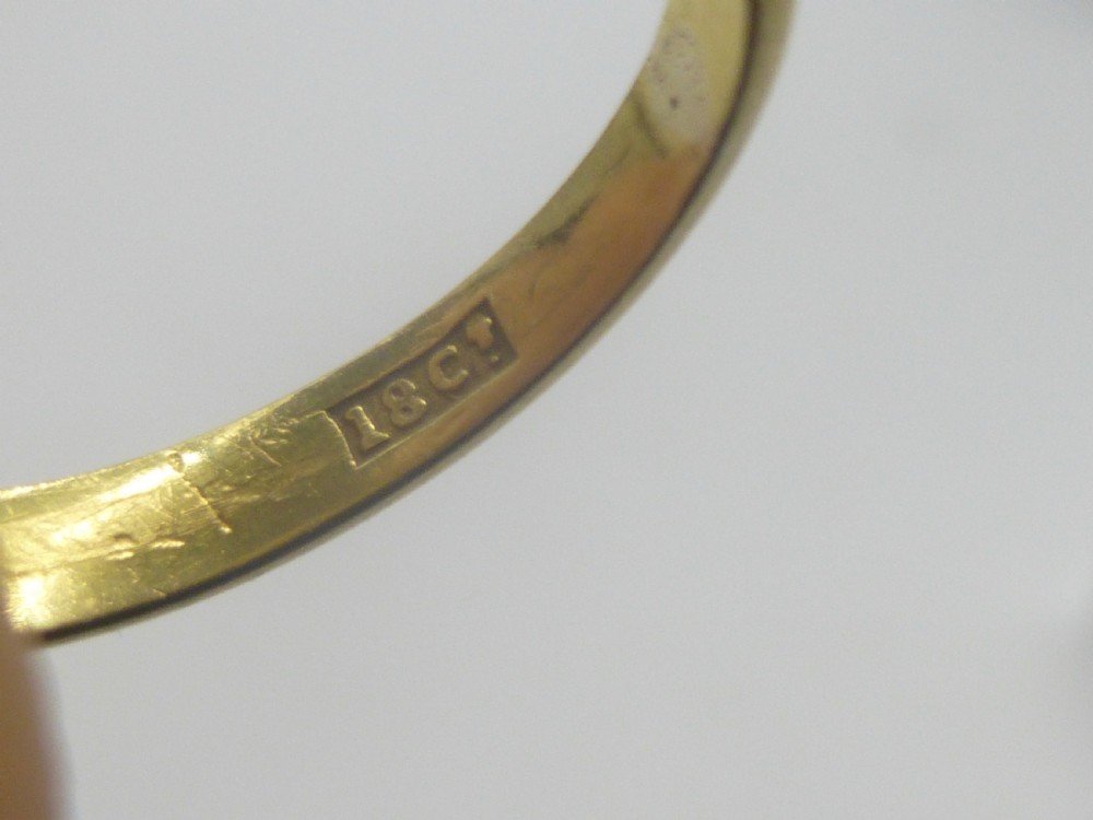 A Victorian 18ct yellow gold gypsy ring featuring a centrally inset round diamond within a smooth tapered band. View IV