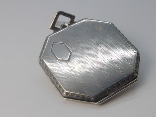 An Art Deco silver cased large locket