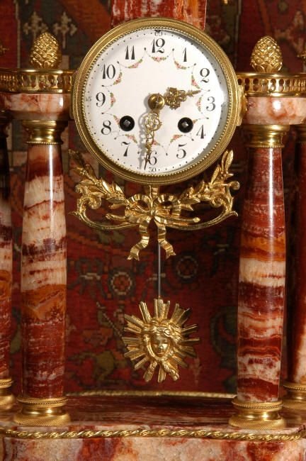 fig 2. Red Marble and Ormolu Portico Clock Set
 by Fritz Marti 
