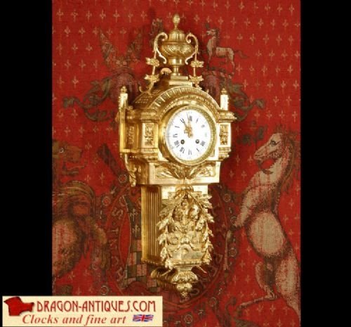 Antique French Gilt Brass Cartel Wall Clock
by Samuel Marti.