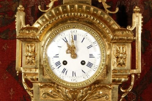 fig 3. Antique French Gilt Brass Cartel Wall Clock
by Samuel Marti. 