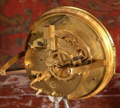 fig 4. Antique French Gilt Brass Cartel Wall Clock
by Samuel Marti. 