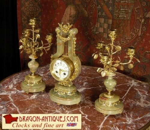 Beautiful Boudoir Lyre Clock Set
by A. D. Mougin.