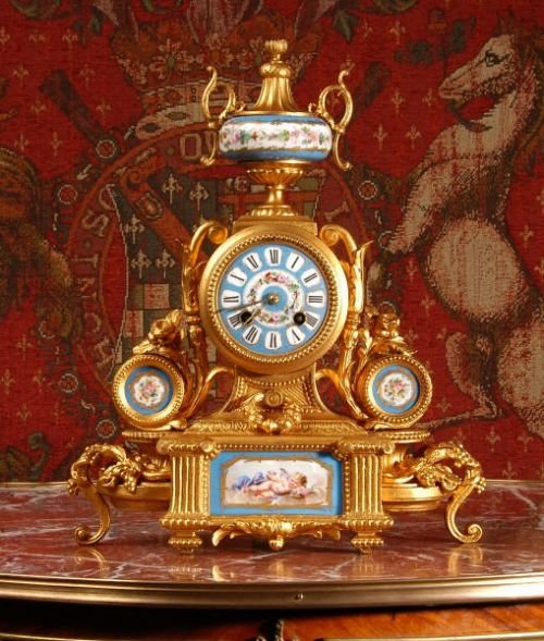 fig 1. Sevres Porcelain and Gilt Metal Boudoir Clock.
by Japy Freres
Sevres Porcelain and Gilt Metal Boudoir Clock.
by Japy Freres