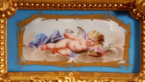 fig 4. Sevres Porcelain and Gilt Metal Boudoir Clock.
by Japy Freres
Sevres Porcelain and Gilt Metal Boudoir Clock.
by Japy Freres