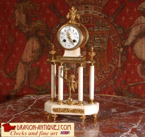 Ormolu and White Marble Antique French Boudoir Portico Clock
by A. D. Mougin.