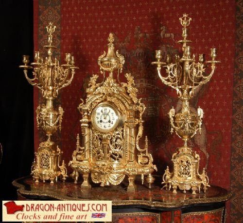 Huge Antique French Gilt Brass Clock Set
by Samuel Marti