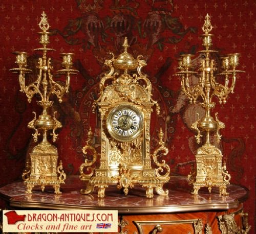 Antique French Gilt Brass Clock Set
by Samuel Marti