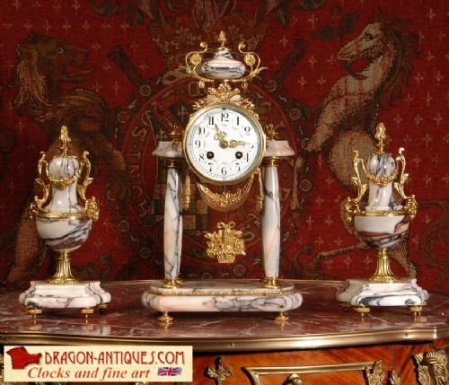 Stunning Marble and Ormolu Portico Clock Set
by Samuel Marti