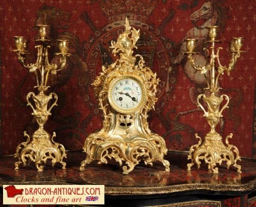 Antique French Gilt Brass Clock Set
by Samuel Marti