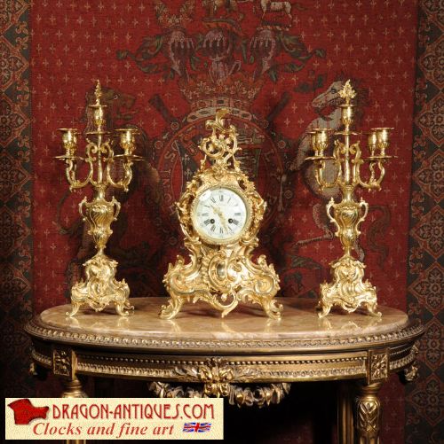Rococo Antique French Gilt Brass Clock Set
by Vincenti Et Cie
