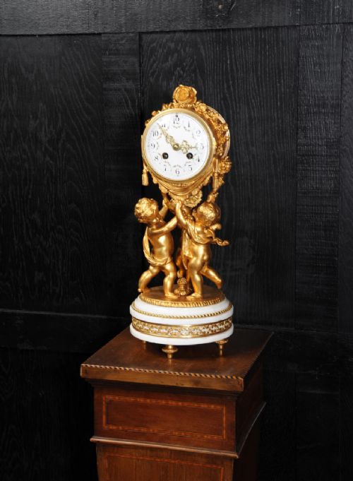 fig 2. Superb Antique French Cherub Clock by Vincenti - visible pendulum
