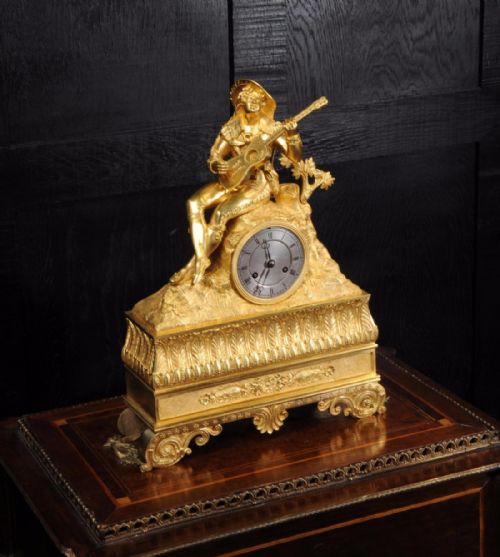 fig 3. Early Ormolu Clock ~ Cavalier Playing a Guitar