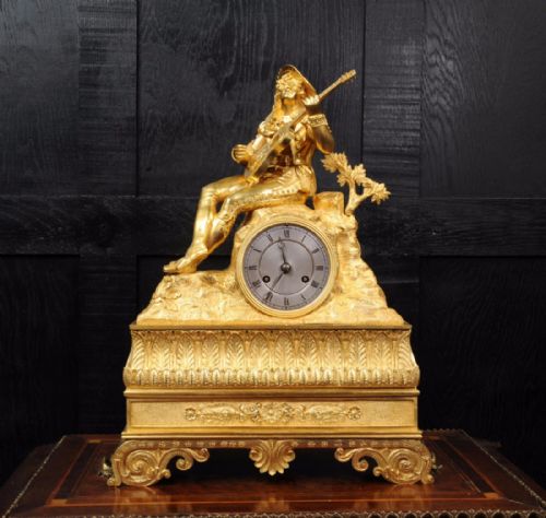 fig 5. Early Ormolu Clock ~ Cavalier Playing a Guitar