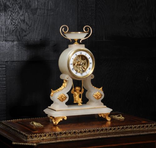 fig 1. Rare Cherub On A Swing Antique French Boudoir Clock with visible escapement