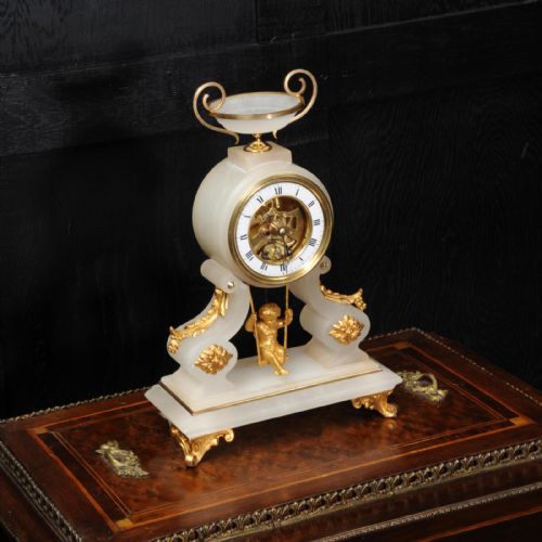 fig 3. Rare Cherub On A Swing Antique French Boudoir Clock with visible escapement