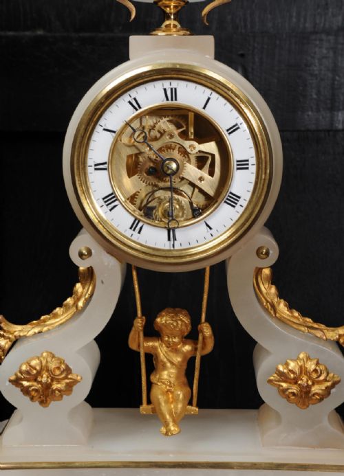 fig 4. Rare Cherub On A Swing Antique French Boudoir Clock with visible escapement